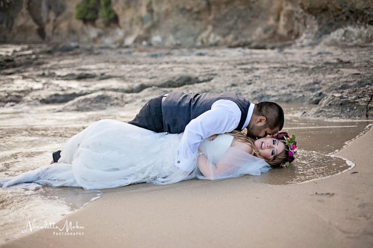 beach trash the dress, beach wedding, elaine traches, flower crown wedding photos, formal wedding portraits on the beach, laguna beach family photographer, laguna beach wedding, laguna beach wedding photographer, oc wedding photographer, orange county wedding photographer, outdoor wedding, tide pool wedding photos, trash the dress, trash the dress session, water trash the dress, wedding photos in the water, wedding photos on the beach, whimsical wedding portraits