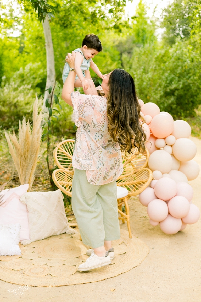 mommy and me session, spring mini session, styled spring session, outdoor family pictures, contemporary family pictures, daisy rattan chair, drea designs, balloon garland, mommy and baby photos, mothers day pictures, whittier photographer, whittier family photographer